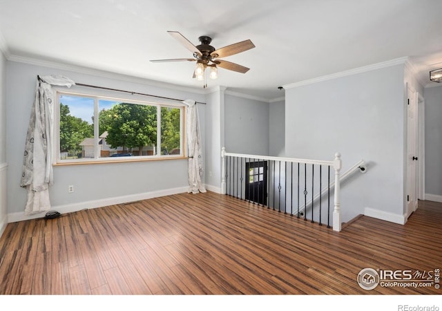 518 Whitmore Ct, Johnstown, CO 80534 - unfurnished room featuring wood finished floors, ceiling fan, baseboards, and crown molding