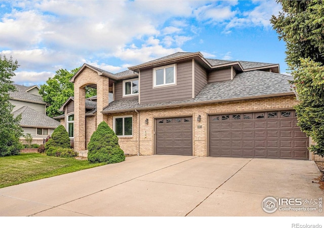 13971 Telluride Dr, Broomfield, CO 80020 - view of front of property with brick siding, concrete driveway, roof with shingles, a garage, and a front lawn