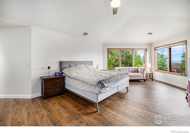 13971 Telluride Dr, Broomfield, CO 80020 - bedroom with baseboards, wood finished floors, ceiling fan, and vaulted ceiling
