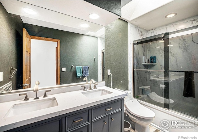 13971 Telluride Dr, Broomfield, CO 80020 - bathroom with a textured wall, toilet, recessed lighting, and double vanity