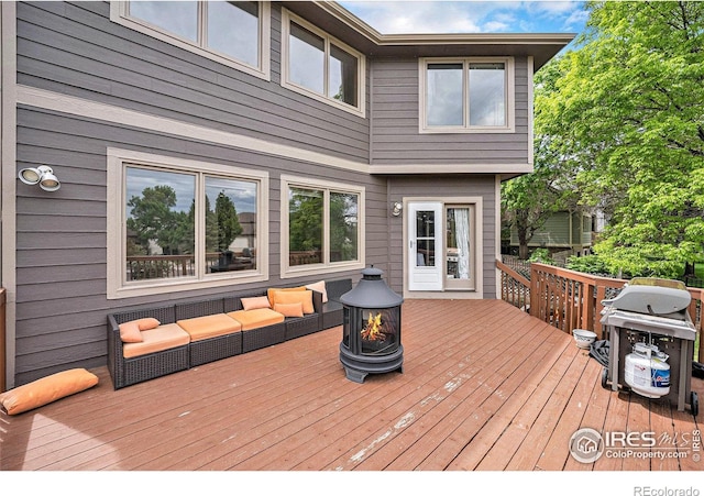 13971 Telluride Dr, Broomfield, CO 80020 - deck with an outdoor living space with a fire pit and a grill