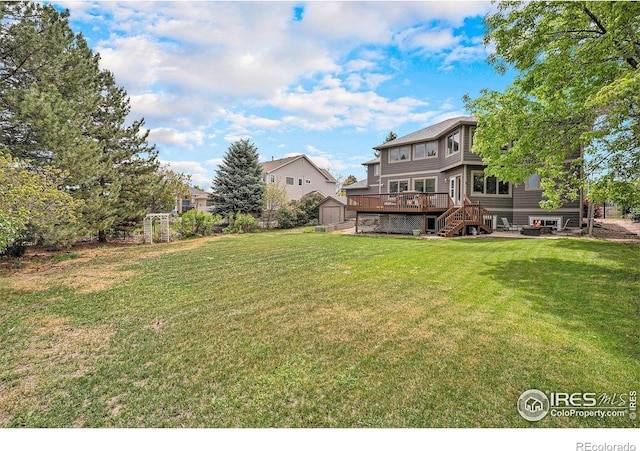 13971 Telluride Dr, Broomfield, CO 80020 - view of grassy yard with a wooden deck