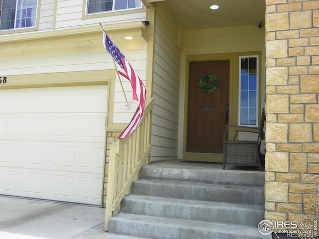 368 Mt Bross Ave, Severance, CO 80550 - doorway to property with a garage and stone siding