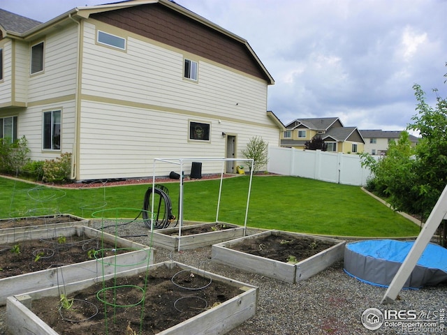 368 Mt Bross Ave, Severance, CO 80550 - rear view of house featuring a garden