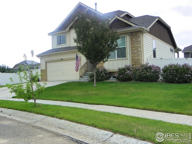 368 Mt Bross Ave, Severance, CO 80550 - view of front of home featuring stone siding, driveway, and an attached garage