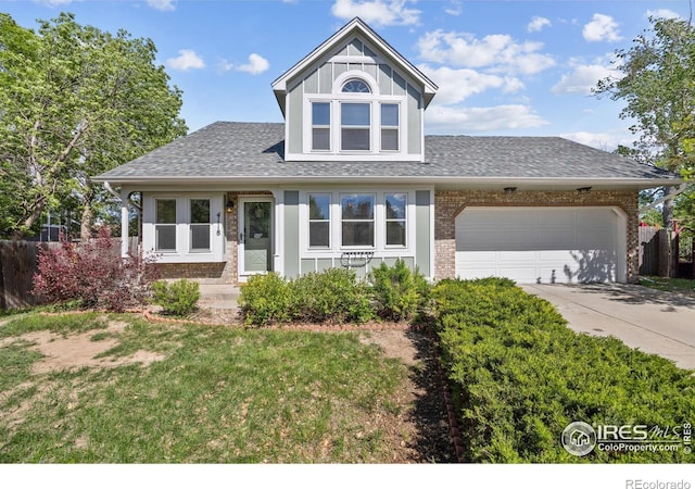 4118 Dillon Way, Fort Collins, CO 80526 - view of front of property with brick siding, roof with shingles, an attached garage, driveway, and a front lawn