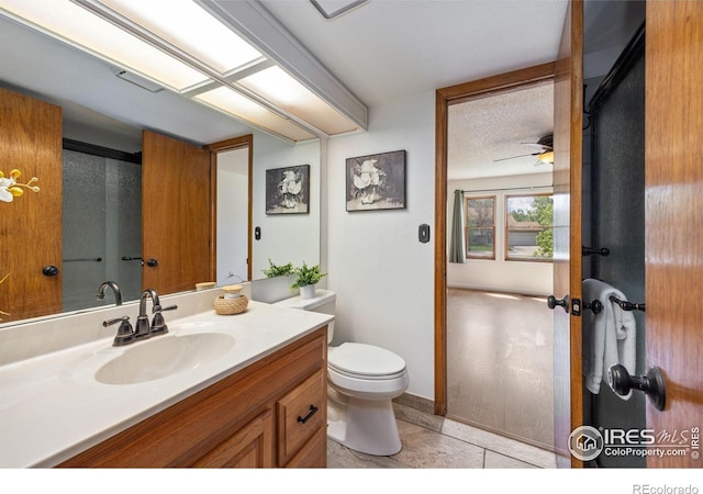4118 Dillon Way, Fort Collins, CO 80526 - bathroom featuring toilet, vanity, tile patterned floors, and a ceiling fan