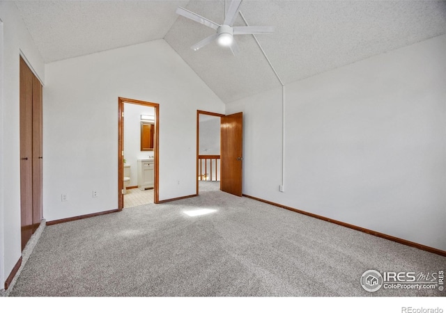 4118 Dillon Way, Fort Collins, CO 80526 - unfurnished bedroom featuring carpet flooring, vaulted ceiling, connected bathroom, baseboards, and a ceiling fan