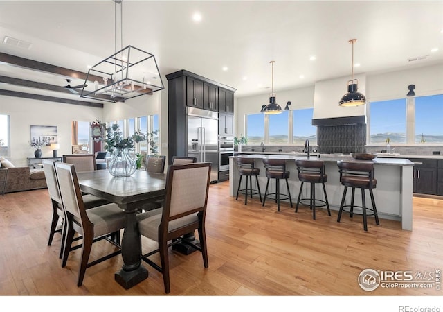 2387 Harding Park Ct, Berthoud, CO 80513 - dining space featuring a chandelier, light wood-style flooring, and recessed lighting