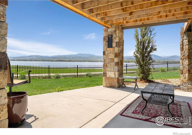2387 Harding Park Ct, Berthoud, CO 80513 - view of patio featuring a water and mountain view