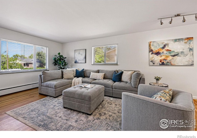 325 Colgate St, Boulder, CO 80305 - living room with wood finished floors, track lighting, and baseboard heating