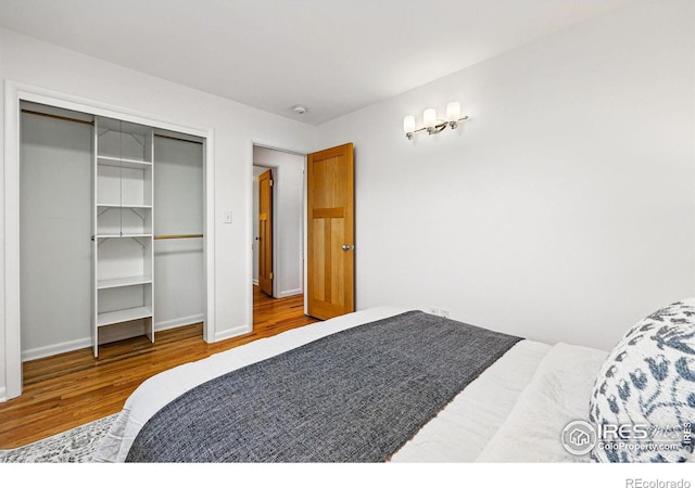 325 Colgate St, Boulder, CO 80305 - bedroom with wood finished floors, a closet, and baseboards