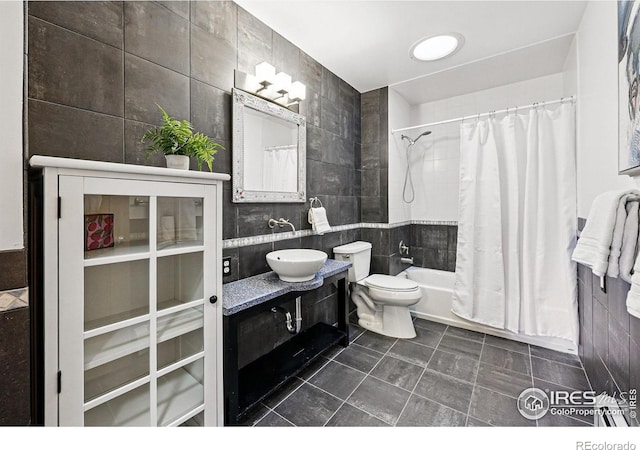 325 Colgate St, Boulder, CO 80305 - full bathroom featuring tile walls, shower / tub combo with curtain, toilet, vanity, and tile patterned flooring