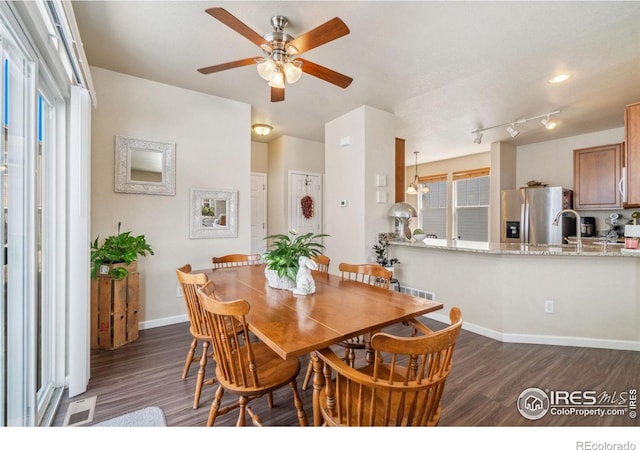 2320 Clipper Way, Fort Collins, CO 80524 - dining room featuring dark wood-type flooring, ceiling fan, and baseboards