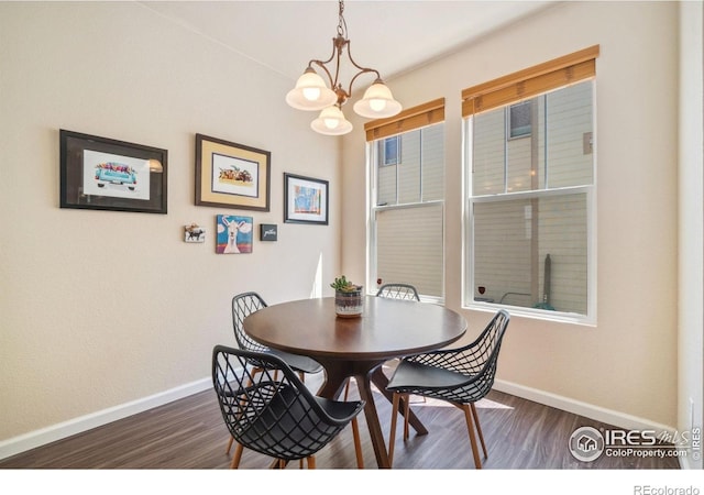 2320 Clipper Way, Fort Collins, CO 80524 - dining room with baseboards, a chandelier, and dark wood finished floors