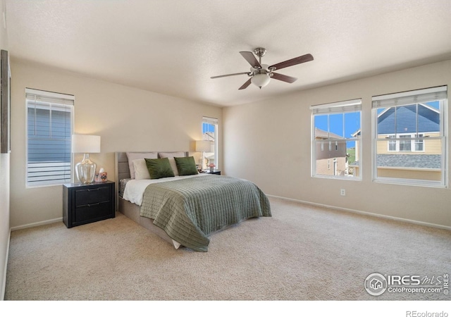 2320 Clipper Way, Fort Collins, CO 80524 - carpeted bedroom featuring baseboards and a ceiling fan