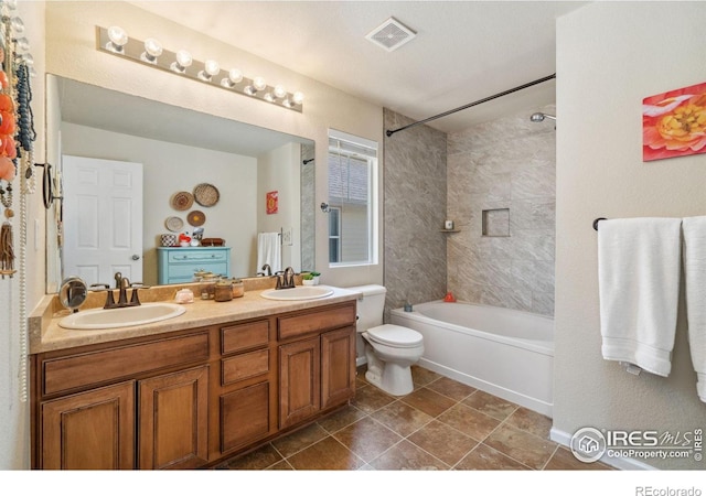 2320 Clipper Way, Fort Collins, CO 80524 - bathroom featuring double vanity, toilet, washtub / shower combination, and tile patterned flooring