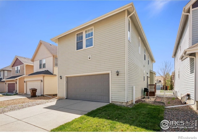 2320 Clipper Way, Fort Collins, CO 80524 - view of front facade featuring an attached garage, driveway, and a front yard