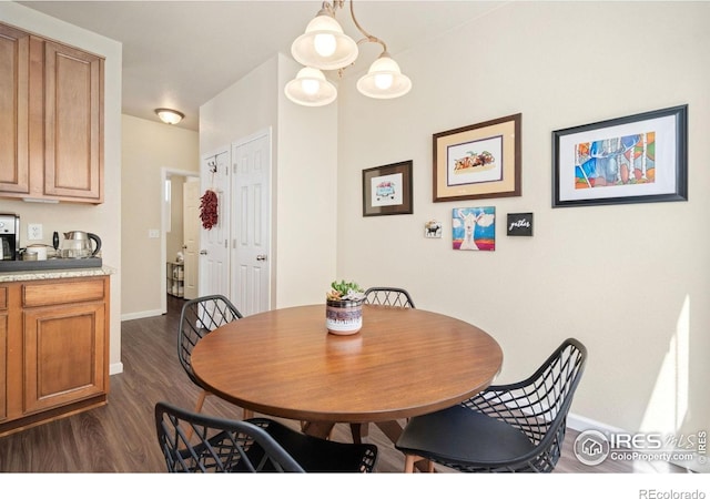 2320 Clipper Way, Fort Collins, CO 80524 - dining space with baseboards and dark wood-style floors