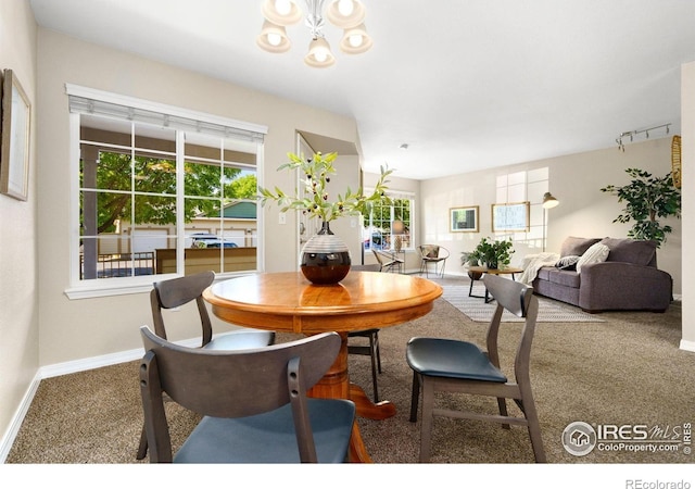 5551 Cornerstone Dr Unit 26, Fort Collins, CO 80528 - dining room featuring carpet flooring, a chandelier, and baseboards