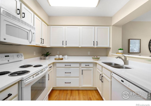 5551 Cornerstone Dr Unit 26, Fort Collins, CO 80528 - kitchen featuring white appliances, a sink, light wood finished floors, and white cabinets
