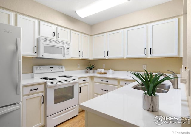 5551 Cornerstone Dr Unit 26, Fort Collins, CO 80528 - kitchen with white appliances, light countertops, and white cabinets