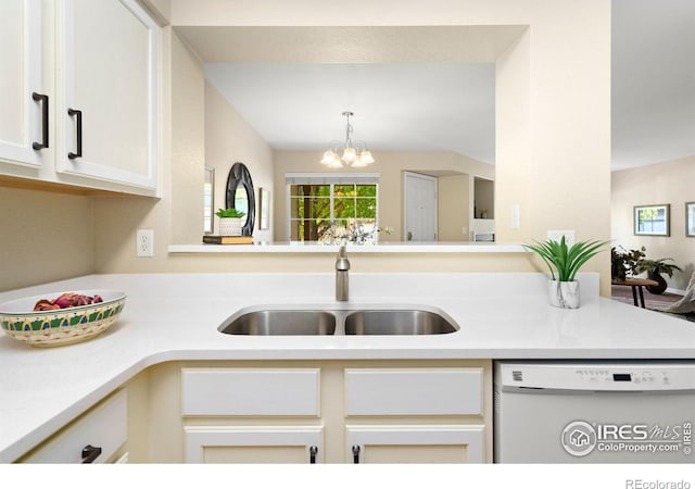 5551 Cornerstone Dr Unit 26, Fort Collins, CO 80528 - kitchen with white dishwasher, a sink, light countertops, a chandelier, and white cabinets