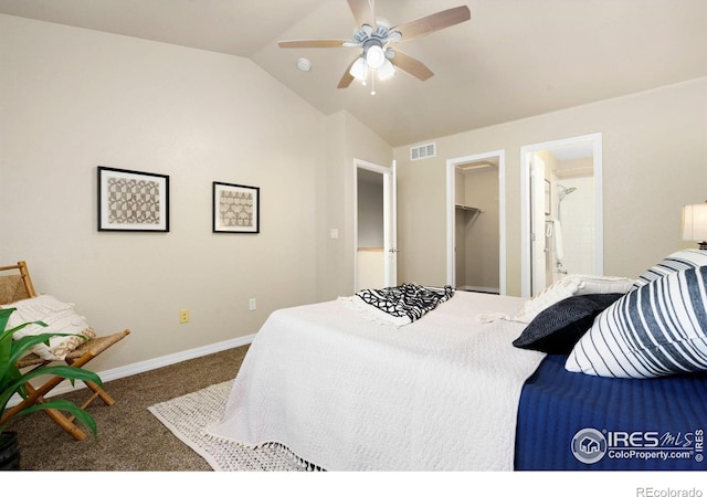 5551 Cornerstone Dr Unit 26, Fort Collins, CO 80528 - carpeted bedroom featuring vaulted ceiling, a walk in closet, baseboards, a ceiling fan, and ensuite bath