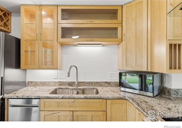 1805 Kinnikinnik Pl, Loveland, CO 80537 - kitchen with stainless steel appliances, light brown cabinetry, and a sink