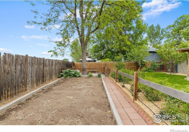 1805 Kinnikinnik Pl, Loveland, CO 80537 - view of yard with a vegetable garden