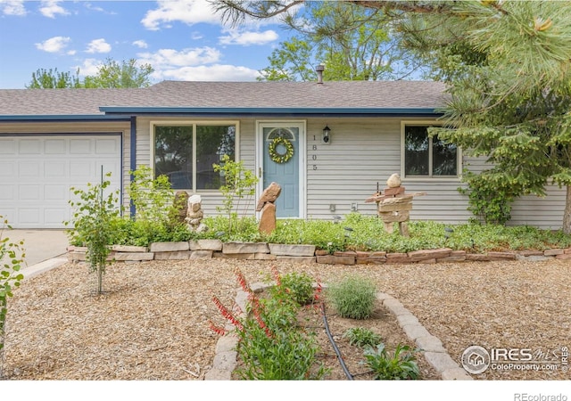 1805 Kinnikinnik Pl, Loveland, CO 80537 - ranch-style home featuring an attached garage and roof with shingles
