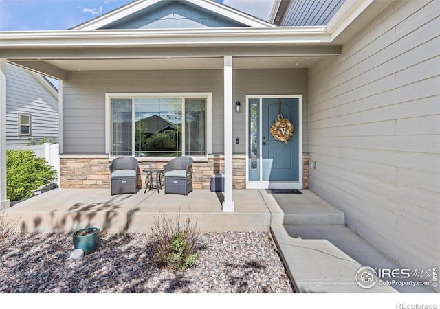 6848 Pettigrew St, Wellington, CO 80549 - property entrance with stone siding and a porch