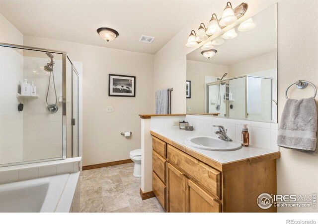 6848 Pettigrew St, Wellington, CO 80549 - full bathroom with a shower stall, toilet, vanity, and baseboards