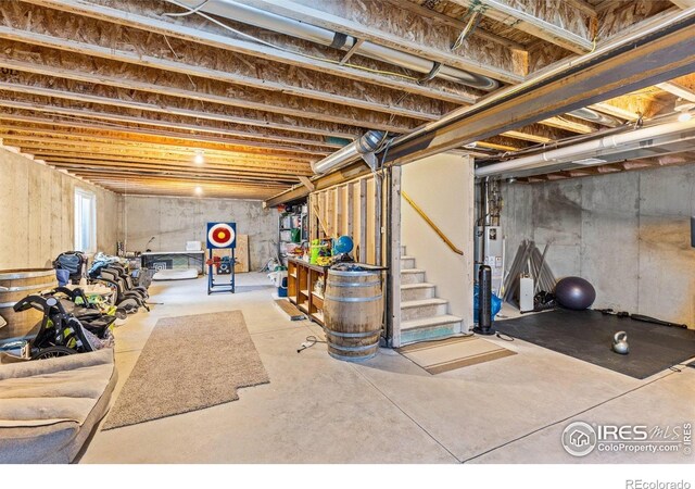 6848 Pettigrew St, Wellington, CO 80549 - unfinished basement with stairs and water heater