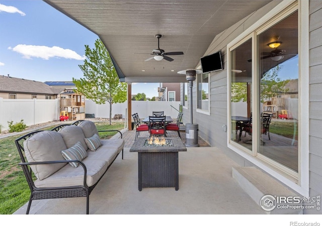 6848 Pettigrew St, Wellington, CO 80549 - fenced backyard featuring outdoor dining space, a patio, a ceiling fan, and an outdoor hangout area