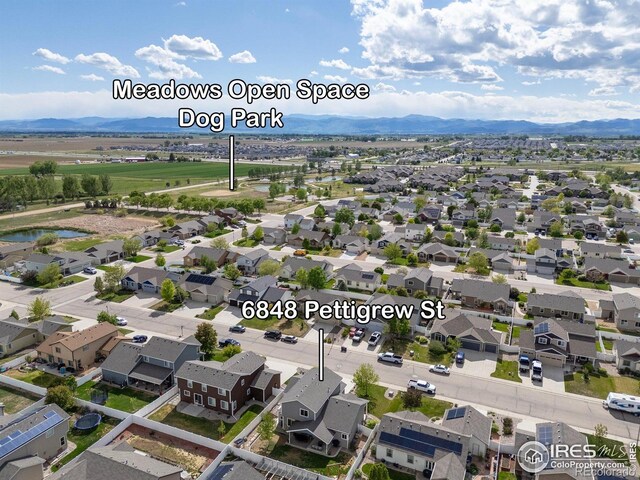 6848 Pettigrew St, Wellington, CO 80549 - aerial view of residential area with a water and mountain view