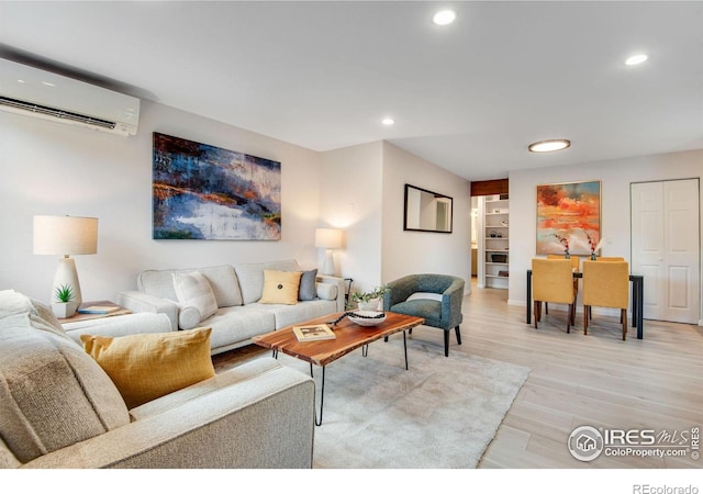 4795 Tantra Dr, Boulder, CO 80305 - living room with an AC wall unit, recessed lighting, light wood-style flooring, and baseboards