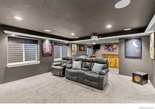 6681 6th St, Frederick, CO 80530 - cinema featuring a textured ceiling, a textured wall, carpet floors, baseboards, and recessed lighting