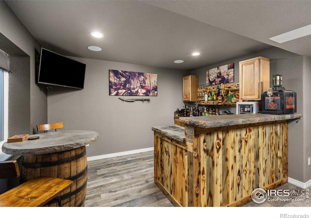 6681 6th St, Frederick, CO 80530 - indoor dry bar featuring baseboards, recessed lighting, and light wood-style floors