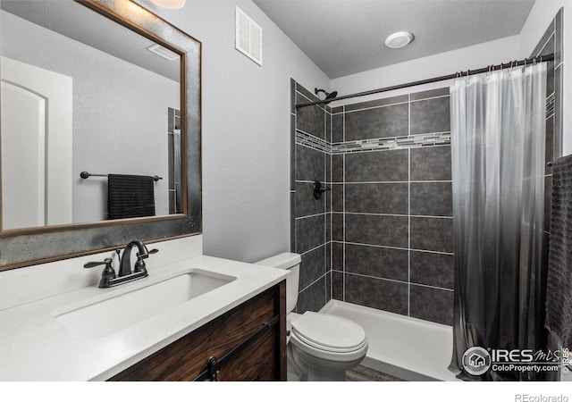 6681 6th St, Frederick, CO 80530 - full bath featuring toilet, vanity, a tile shower, and a textured wall