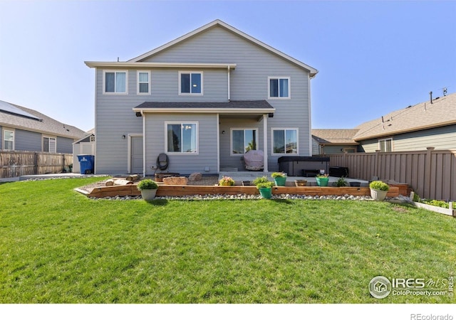 6681 6th St, Frederick, CO 80530 - back of property with a garden and a patio