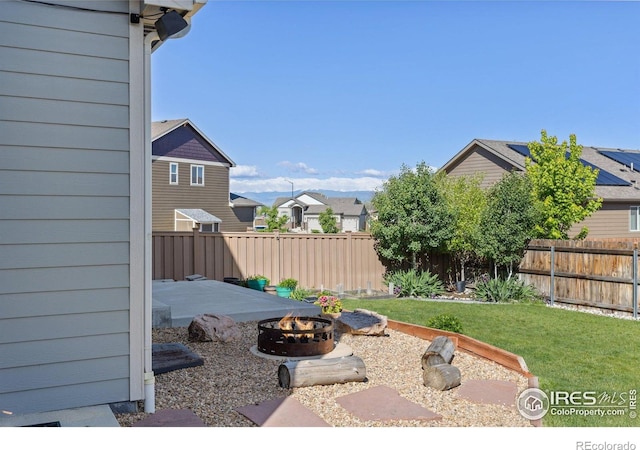 6681 6th St, Frederick, CO 80530 - view of yard featuring an outdoor fire pit, a patio, and a residential view