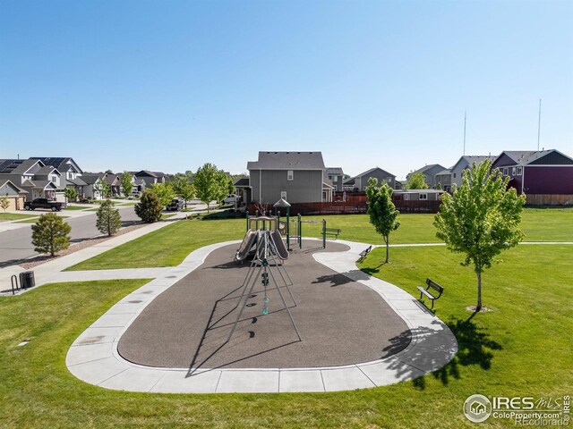 6681 6th St, Frederick, CO 80530 - view of home's community featuring a residential view and a lawn