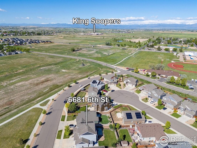 6681 6th St, Frederick, CO 80530 - aerial view of property's location with nearby suburban area and a mountain backdrop
