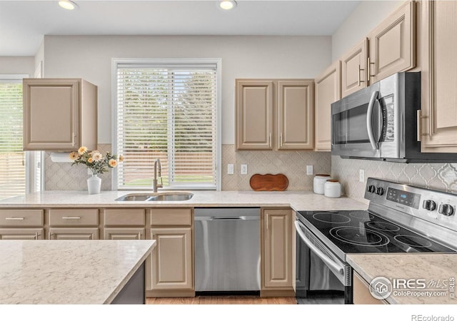 5348 Wild Dunes Ct, Boulder, CO 80301 - kitchen with stainless steel appliances, a sink, light countertops, recessed lighting, and decorative backsplash