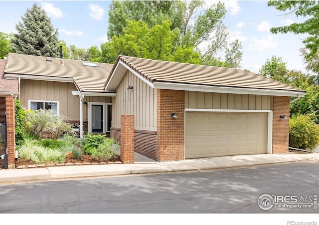 4924 Clubhouse Ct, Boulder, CO 80301 - ranch-style home featuring brick siding, board and batten siding, and a tiled roof