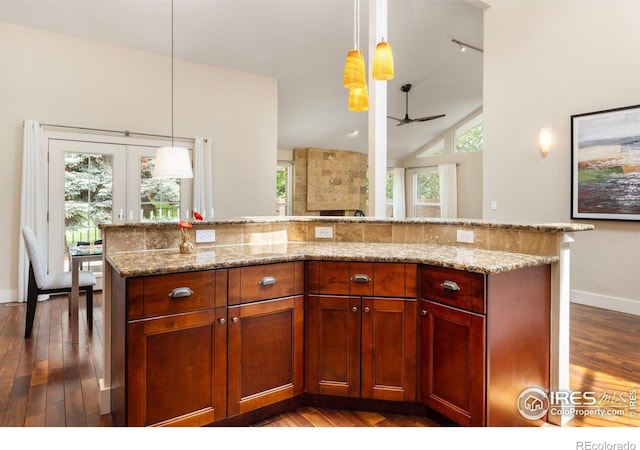 4924 Clubhouse Ct, Boulder, CO 80301 - kitchen with dark wood-style floors, a ceiling fan, light stone counters, plenty of natural light, and vaulted ceiling