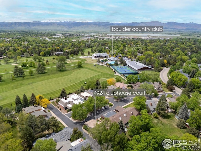 4924 Clubhouse Ct, Boulder, CO 80301 - aerial perspective of suburban area with a mountainous background, a golf course, and property parcel outlined