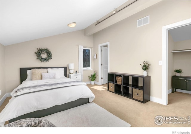 4924 Clubhouse Ct, Boulder, CO 80301 - bedroom with vaulted ceiling, carpet, and a walk in closet