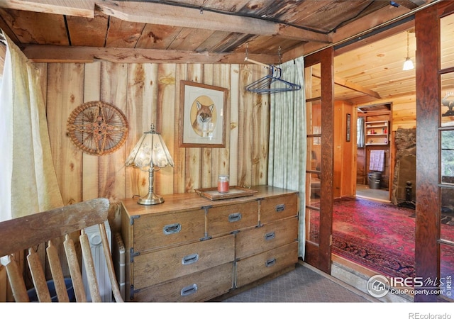 12991 Peak To Peak Hwy, Allenspark, CO 80510 - hallway with wooden ceiling, wooden walls, and carpet